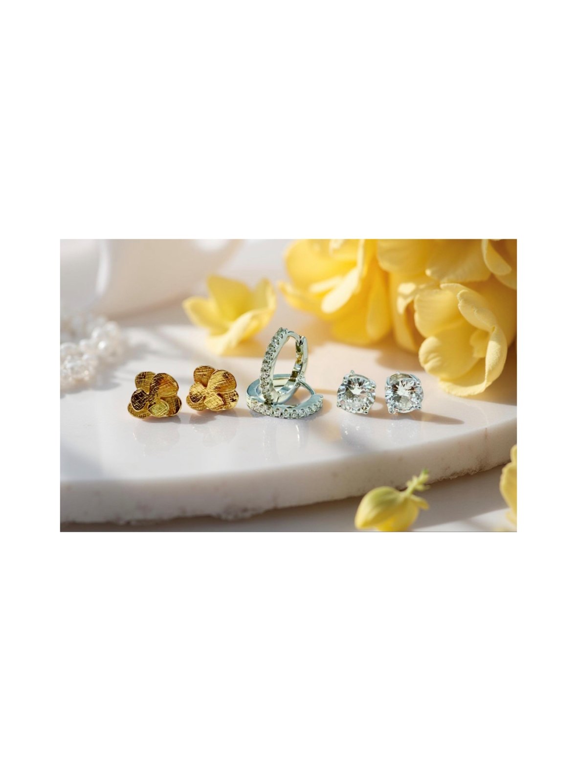 Kukkiva eleganssi - kolmen hopeakorvakorun setti